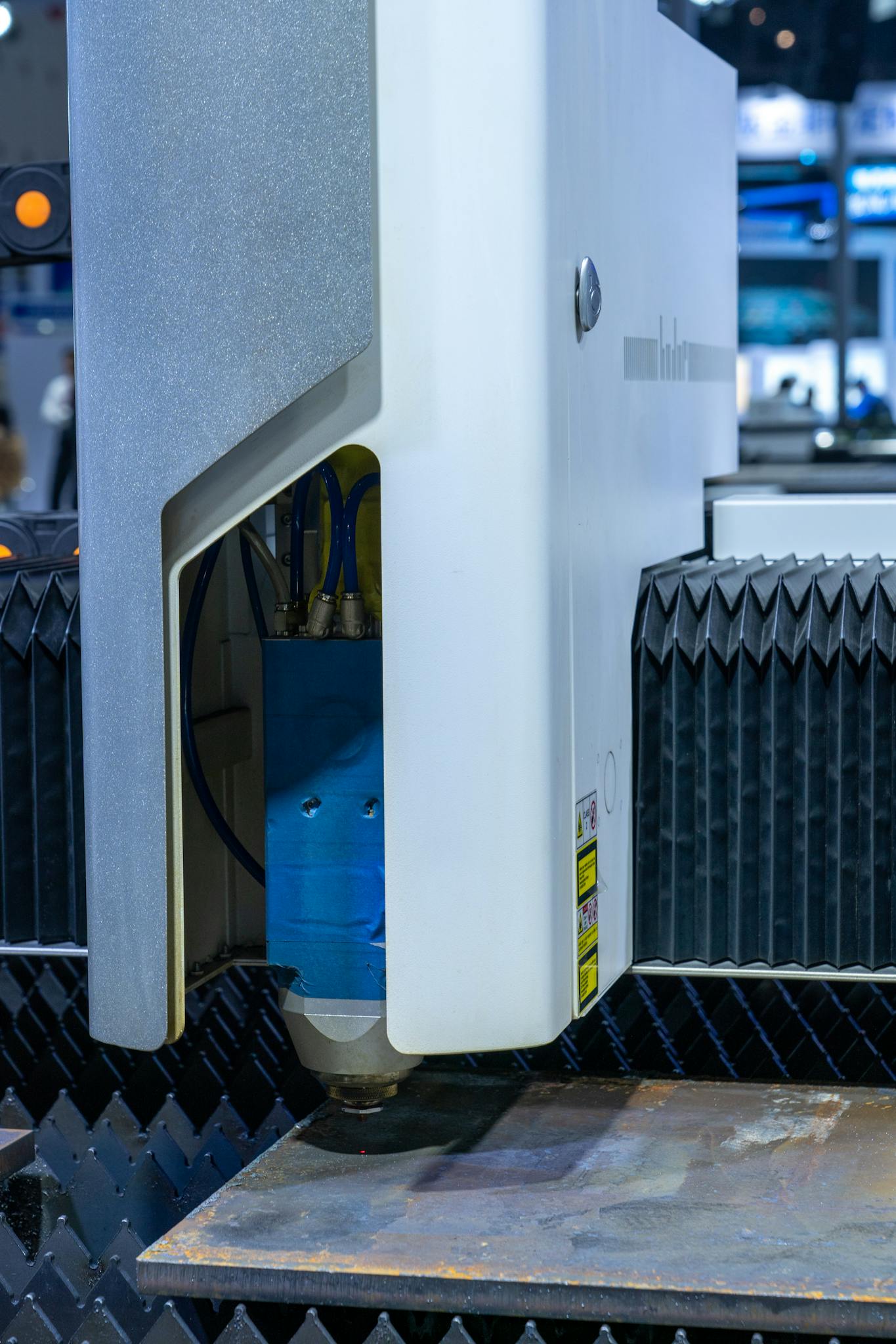 Close-up of a modern laser cutting machine used in industrial manufacturing processes.